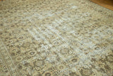 Distressed Sivas carpet showing worn Herati motif, time-softened beige, sand tones, and visible foundation.