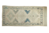 Distressed Vintage Oushak runner, faded ivory field, triple blue medallions, 4'10
