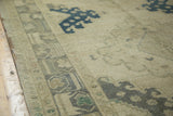 Distressed Oushak runner displaying muted border motifs and soft denim blue pattern on beige.
