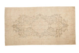 Vintage distressed Oushak runner with a soft seafoam green medallion and ivory florals, 2'9