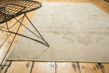 Faded pale beige and ivory floral patterns on this distressed Oushak runner.