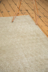 Distressed Oushak rug, soft pile texture and faded Mir Boteh design in ivory beige.