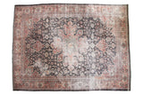 Distressed vintage Mahal rug, oversized medallion, scrolling vinery, softened charcoal, red, ivory.