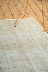 Vintage distressed Oushak runner showing worn pile, visible foundation, and light patterns.