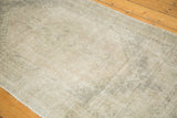 Distressed vintage Oushak rug runner, showcasing even wear across knot heads and neutral geometric motifs.