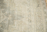 Distressed Oushak runner with even wear, featuring silver, sand, and beige geometric motifs.