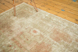 Distressed Oushak rug pile with mostly even wear showing foundations and blush.