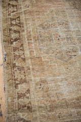 Distressed vintage Oushak runner with faded antique ivory, brown germinating flower and leaf motifs.