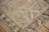 Distressed Oushak runner corner, light coffee brown germinating flower motif, worn texture.