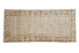 Distressed Oushak runner, pale beige with geometric medallion and faded brown floral border, 3'1