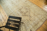 Distressed vintage Oushak runner, faded beige and subtle brown medallion, wear across knot heads.
