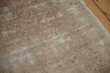 Textured pile of a vintage Oushak runner, showing mostly even wear with faded blush and sand.
