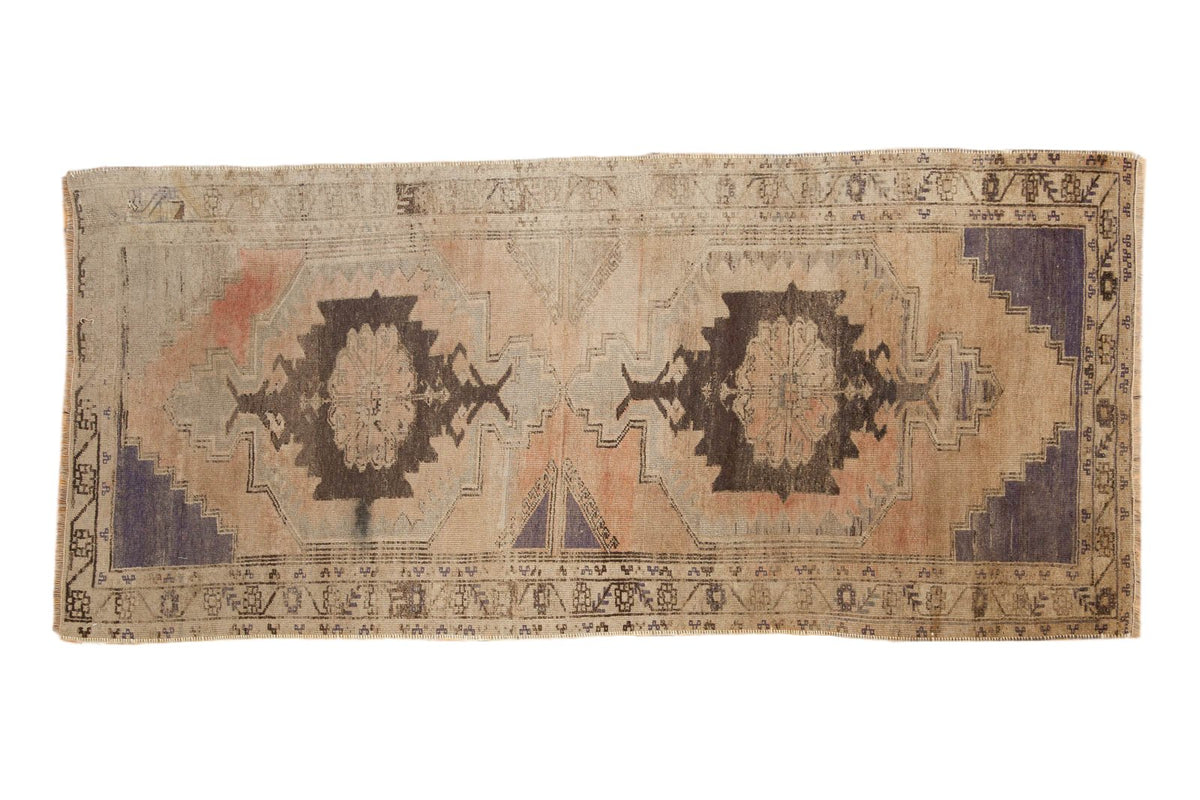 Vintage Distressed Oushak rug runner, geometric double medallion, dusty apricot, sand, charcoal, and royal blue.