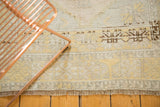 Fringe and lower border detail of a vintage distressed Oushak rug. Pale beige, saffron, and charcoal tones.