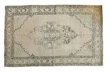 Distressed vintage Oushak rug, pale beige, silver, and charcoal oblong medallion, 6'3