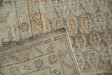 Distressed Oushak rug pile and hand-knotted reverse, featuring silver and terra cotta tones.