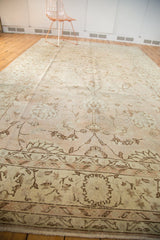 Distressed vintage Oushak rug corner, pale blush, ivory, coffee floral tendrils, low pile.