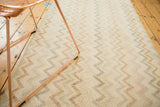 Distressed Oushak runner with faded ivory, blush, and bronze zig-zag chevron pattern.