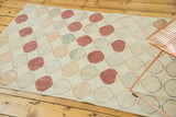 Distressed vintage Oushak runner, rows of geometric circles in ivory, blush, and faded tones.