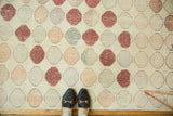 Playful distressed geometric Oushak runner pattern in faded ivory, blush, and subtle earth tones.