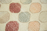 Playful repeating circles in faded blush, peach, and silver tones with distressed texture.
