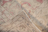 Back of a vintage Turkish rug showing the hand-knotted weave and fully secured side.