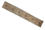 Vintage Serab runner rug with repeating medallions, serrated leaves in tan, navy, and seafoam green.