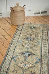 Vintage Serab runner displaying repeating medallions, hook and latch motif, sea foam, navy, and chocolate tones.