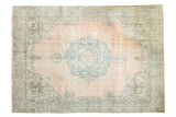 Distressed vintage Oushak rug, blush field, quatrefoil medallion, sky blue cartouche border. 8'6