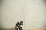 Hand-knotted distressed Oushak rug pile showing even wear, ivory, and subtle aqua.