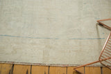 Distressed vintage Oushak rug field, showing wear and subtle sky aqua blue abrashes.