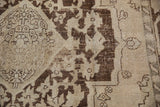 Dynamic character and texture of the distressed pile on a vintage Oushak carpet.