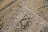 Hand-knotted foundation and secured corner on the back of a distressed vintage Oushak carpet.