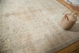 Distressed Oushak carpet border with faded geometric motifs and worn ivory pile.