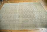 Vintage distressed Kaisary carpet with faded gul motifs and analogous coloration.