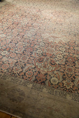 Worn vintage Sivas carpet border and herati motifs in dusty blush, charcoal, and ivory tones.