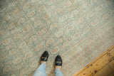 Distressed Oushak rug with faded sea foam green field, blush Mir Boteh, and barber pole border.