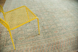 Distressed vintage Oushak carpet featuring ornate Mir Boteh pattern in sea foam green and terra cotta.
