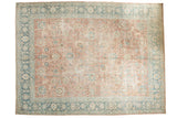 Distressed Persian Tabriz carpet with pale blush beige palmettes and sea foam green borders.