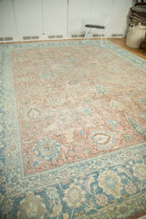 Distressed blush beige and faded blue Tabriz carpet with palmette and leaf motifs.