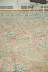 Distressed pile detail of vintage Tabriz rug with faded blush and sea foam palmettes.