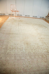 Vintage Distressed Oushak carpet with delicate ivory field, blush pink tendrils, and faded patterns.