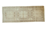 Vintage Distressed Oushak runner featuring three geometric medallions in faded ivory and pale coffee brown.