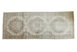 Distressed vintage Sparta runner with beige field and faded grey Oushak-inspired medallions.