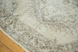 Distressed Sparta rug runner, faded beige and muted brown Oushak-inspired pattern, showing secured edge.
