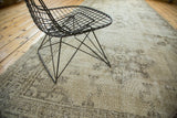 Decorative distressed texture of a vintage Sparta rug runner in beige and charcoal tones.