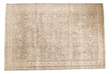 Distressed Sivas carpet, allover floral pattern in muted silver, charcoal, ivory, and blush.