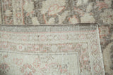 Distressed vintage Sivas carpet pile contrasting with tightly woven pale beige foundation.