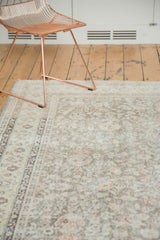 Distressed Sivas carpet texture with even wear and faded floral motifs of pale beige, blush.