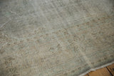 Distressed Oushak rug texture, highlighting worn pile, visible foundation, and subtle patterns.